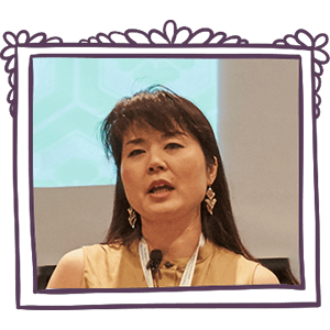 Dr. Megumi Okugiri speaking at a women's leadership event