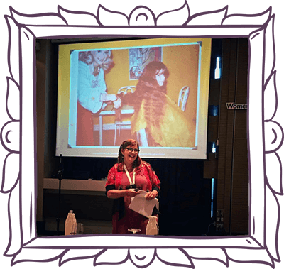 Laura speaking at a conference