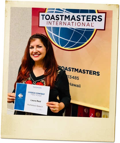 Laura Reid with certificate from First Place at Toastmasters